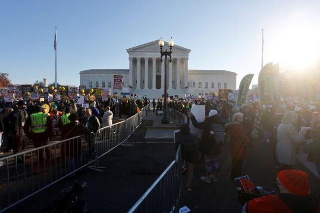 Anti-abortion and pro-abortion rights protesters gather outside Supreme Court in Washington