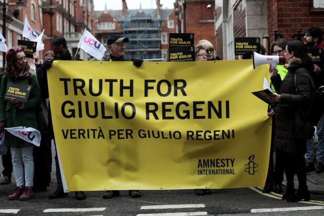 Demo<em></em>nstrators from Amnesty Internatio<em></em>nal hold placards outside the Egyptian embassy in support of Giulio Regeni, who was found murdered in Cairo two years ago, in London