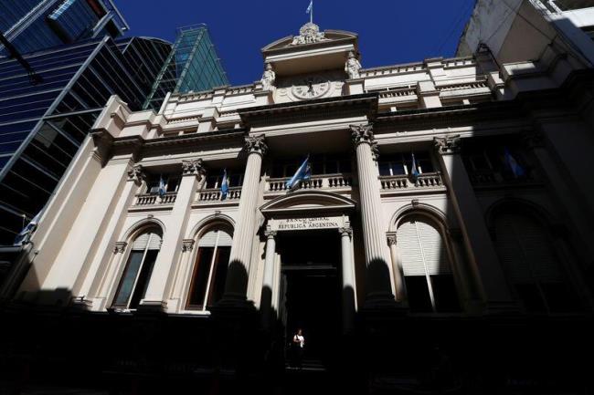 A woman walks out of the Argentina's Central Bank, in Buenos Aires