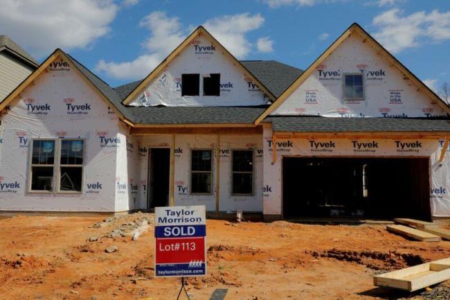 A home under co<em></em>nstruction stands behind a "sold" sign in a new development in York County, South Carolina