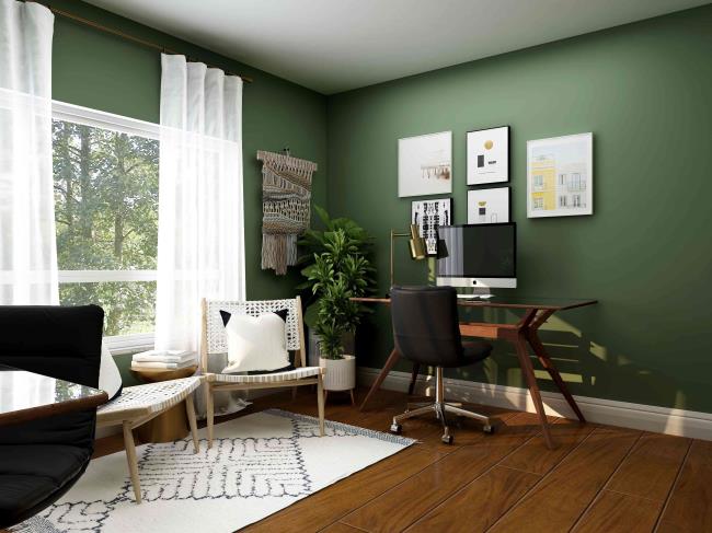 Green painted room with sheer panels next to chairs and office desk