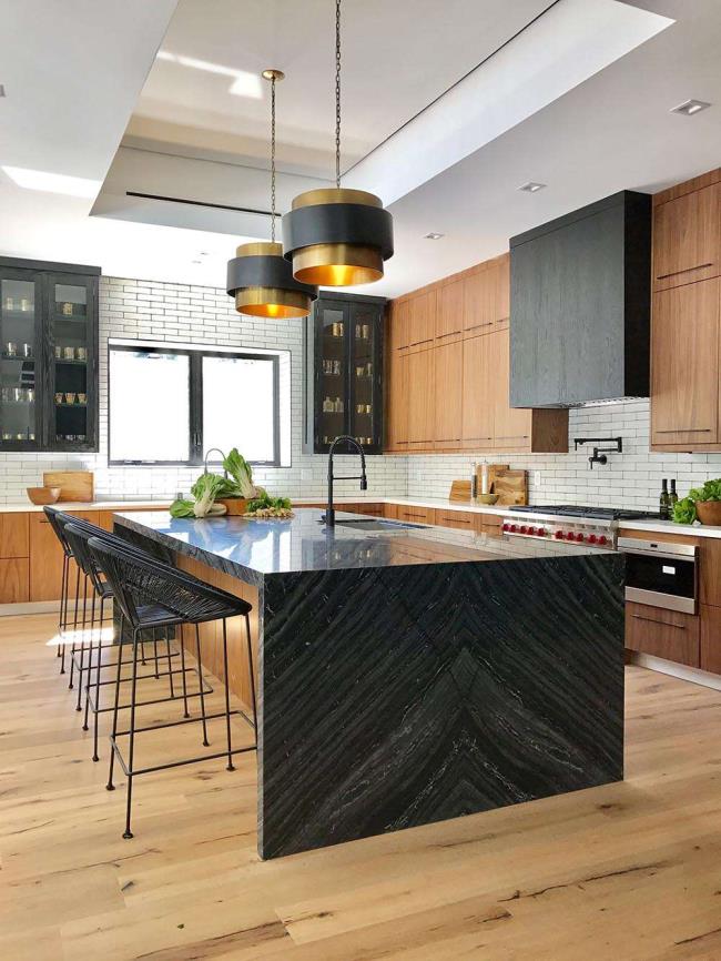 A dramatic black stone waterfall countertop