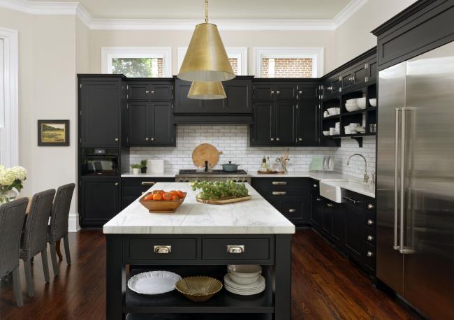 Classic Black kitchen with white tile, white marble countertop island and stainless steel appliances and silver and gold hardware