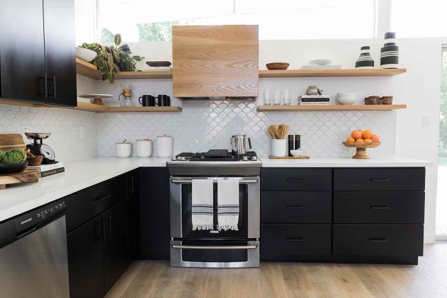 Sleek modern kitchen with black cabinets and open air wood shelves