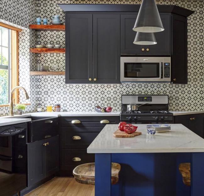 Black and blue kitchen with black and white tiled walls