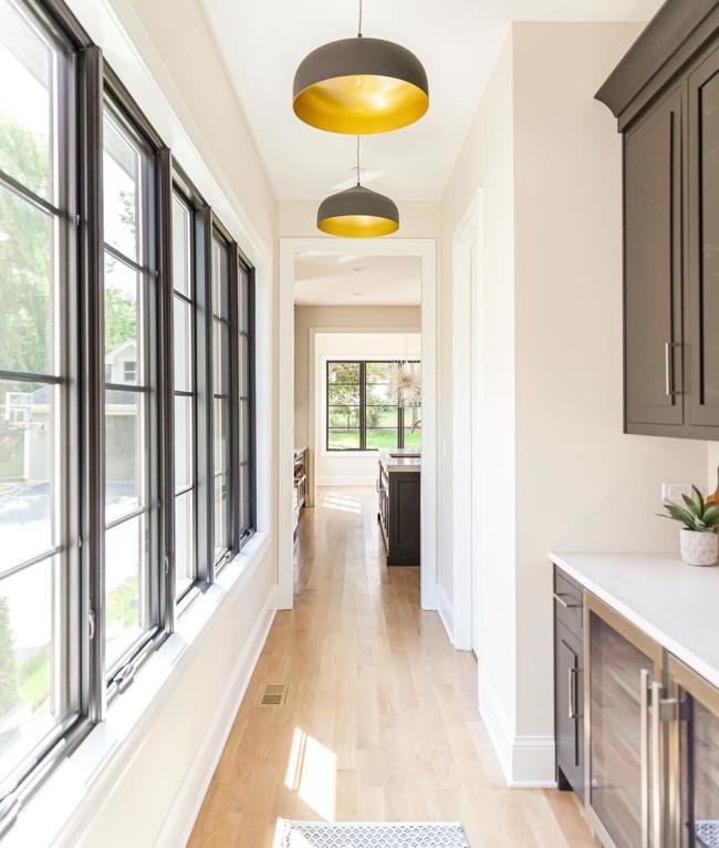 Butler's pantry with large hanging pendant lights