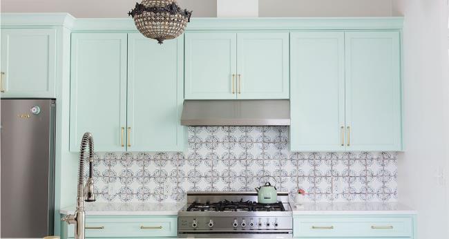 minty green kitchen with brass accents