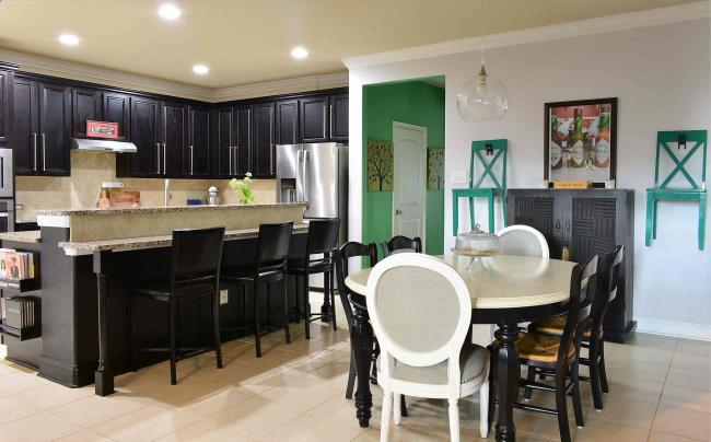 Green accent chairs in kitchen