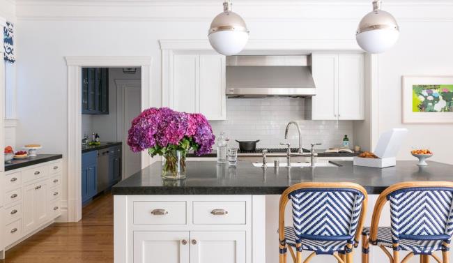 Bright white kitchen with chrome lighting