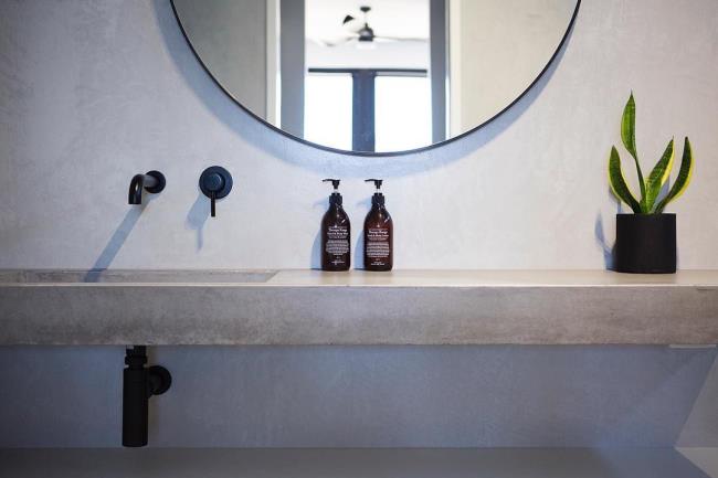 cement sink with plant on the side