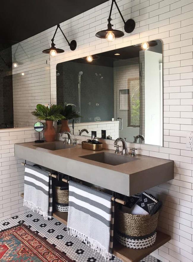 Updated bathroom with tiled floor and cement sink