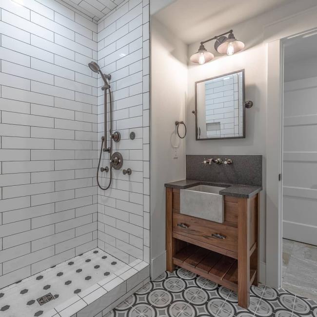 Bathroom with a vanity and cement sink