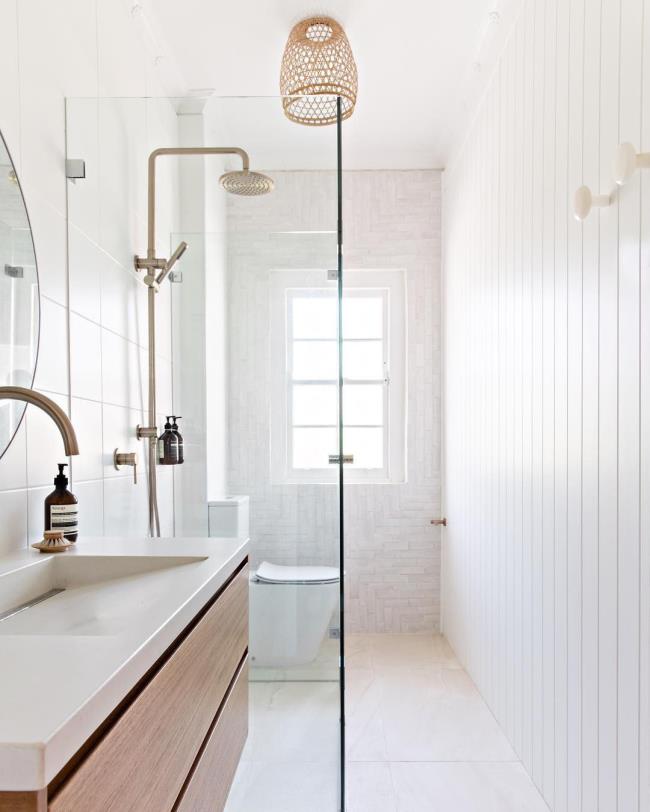 Bathroom with green tiles and pink cement sink