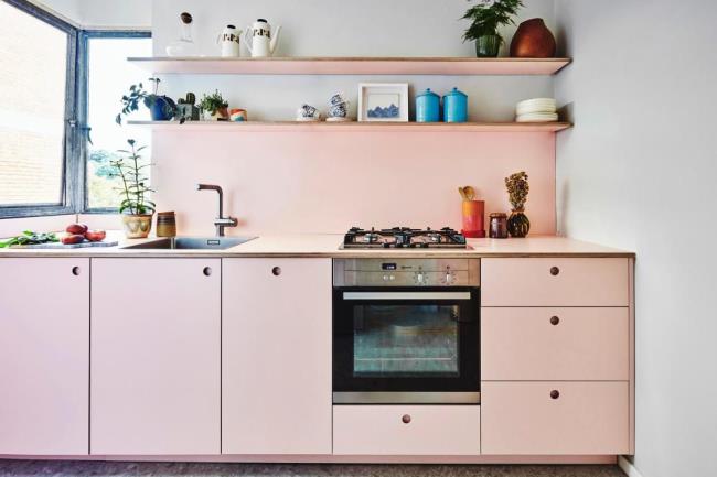 hot pink breakfast nook in a white kitchen