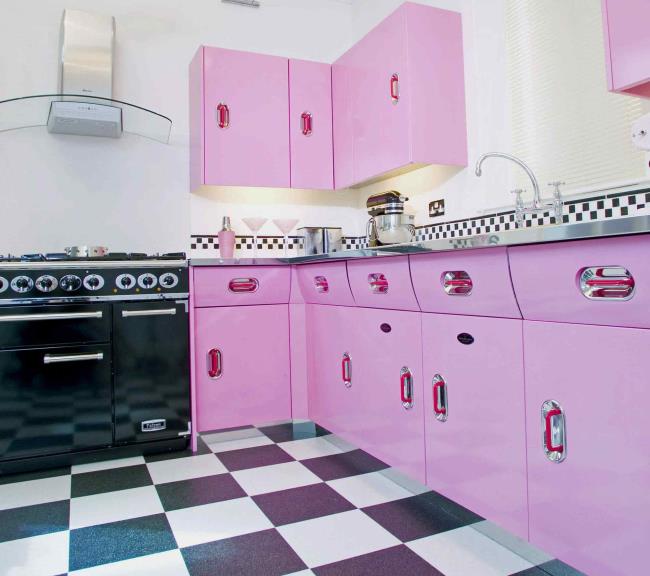 retro pink kitchen with black and white checkered floor tile