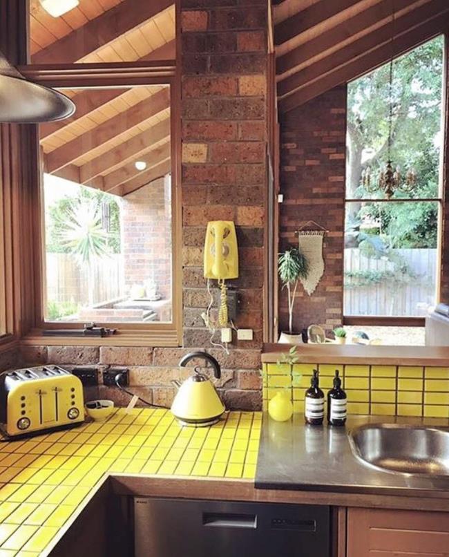 kitchen with yellow tiles and backsplash