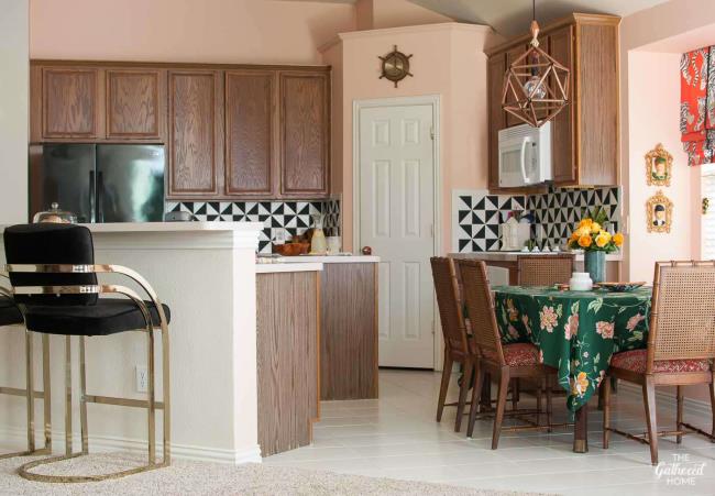 kitchen with wood cabinets and pink walls