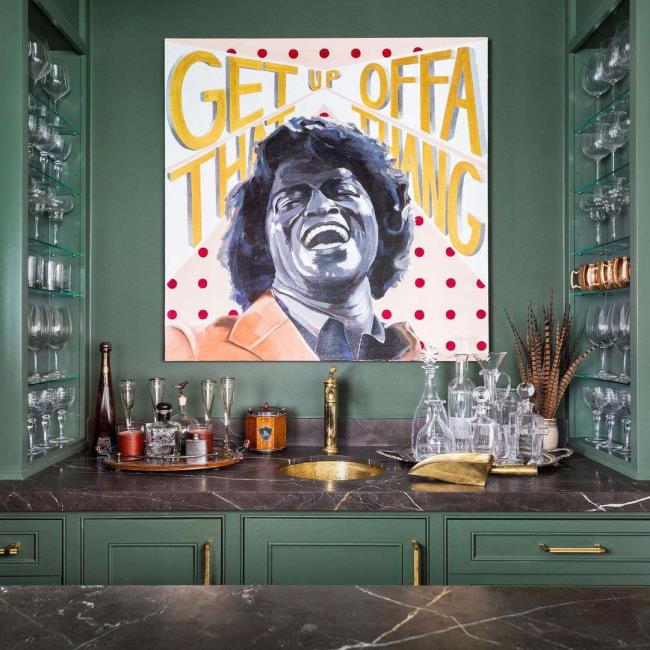 Green wet bar with a large piece of art 