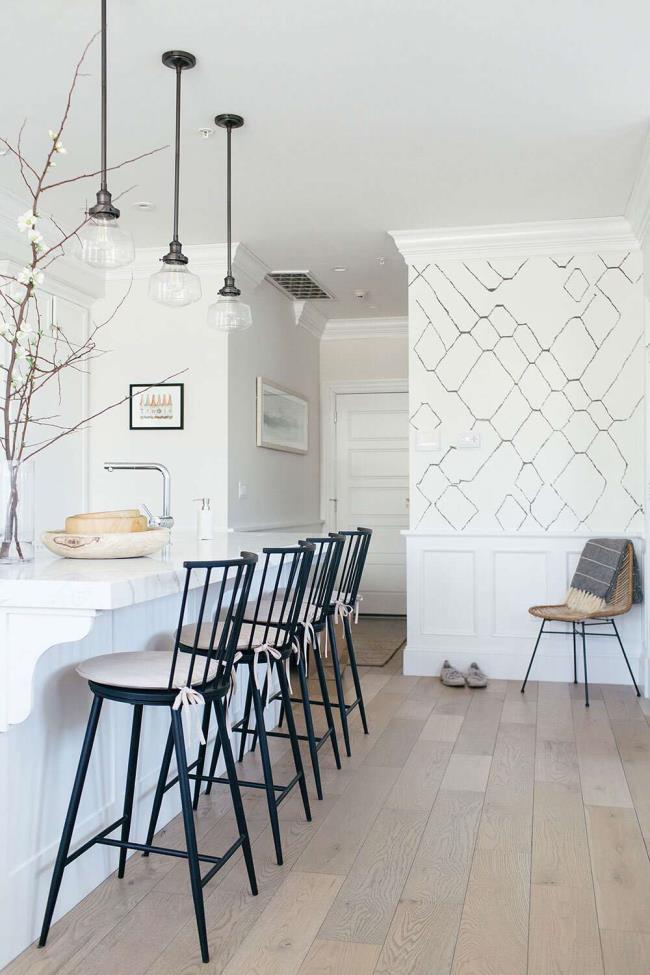 White kitchen with black chairs