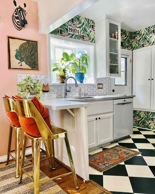 Pink kitchen with palm wallpaper