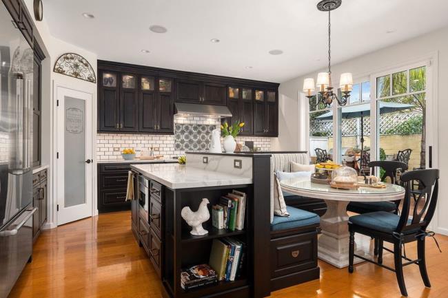 Large brown kitchen with dining table