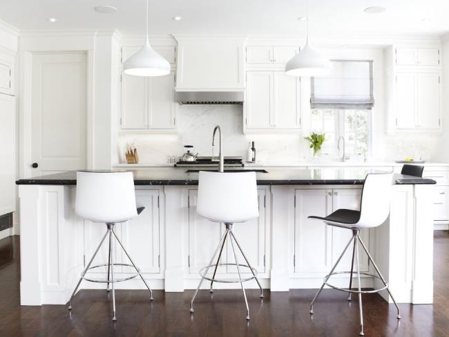 Glam black kitchen with black countertop