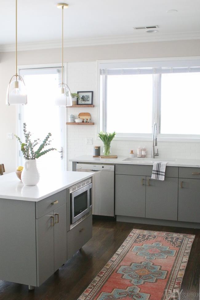 simple gray kitchen with a rug