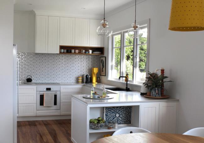 white kitchen with beadboard shaker cabinets