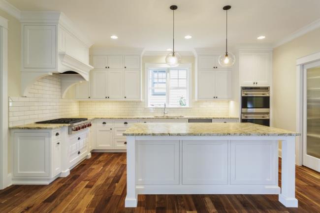 White Retro Style Kitchen with Wood Floor and Island