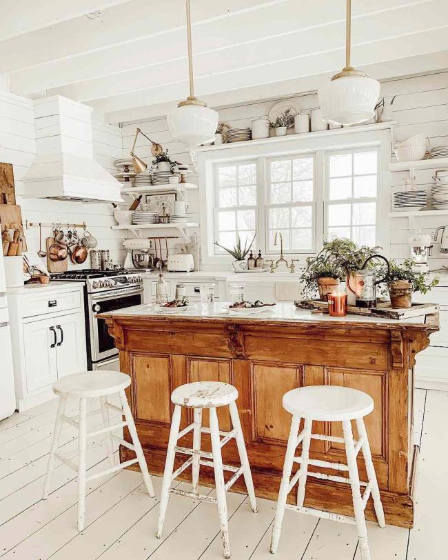 White kitchen with a wooden kitchen island