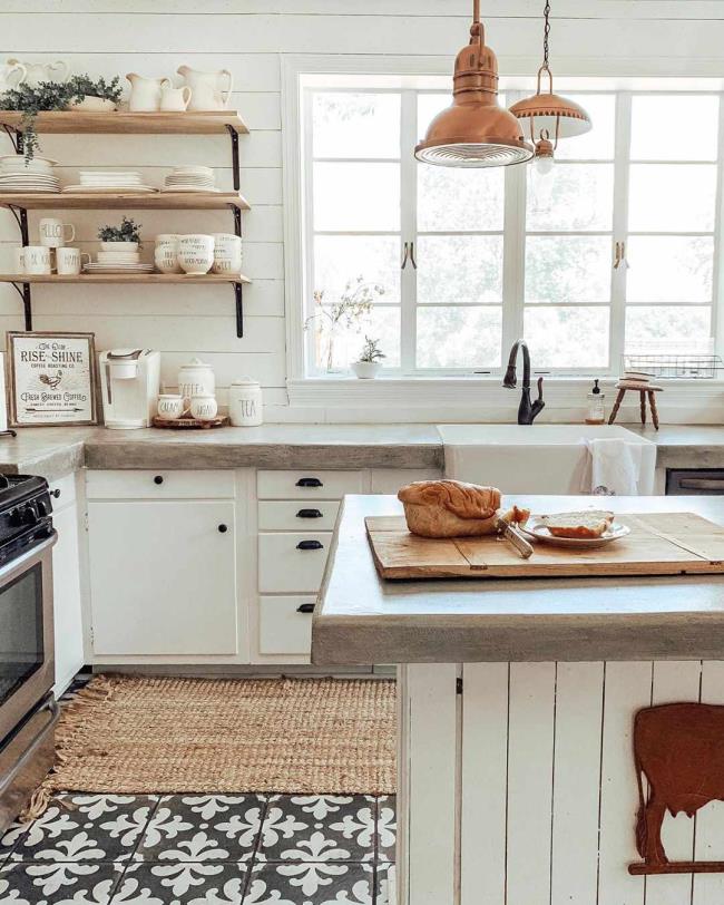 Kitchen with patterned tiles and white kitchen island