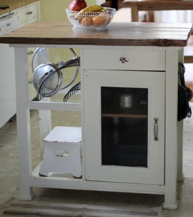 A kitchen island made from a rustic cabinet