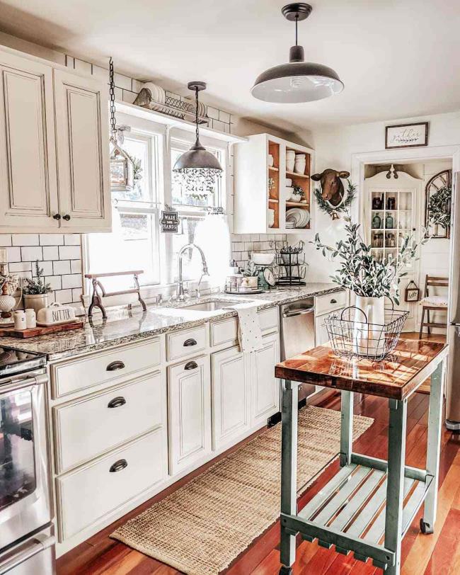 Kitchen with a teal kitchen cart that doubles as an island