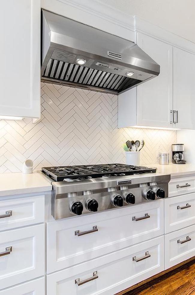 kitchen with herringbone subway tile