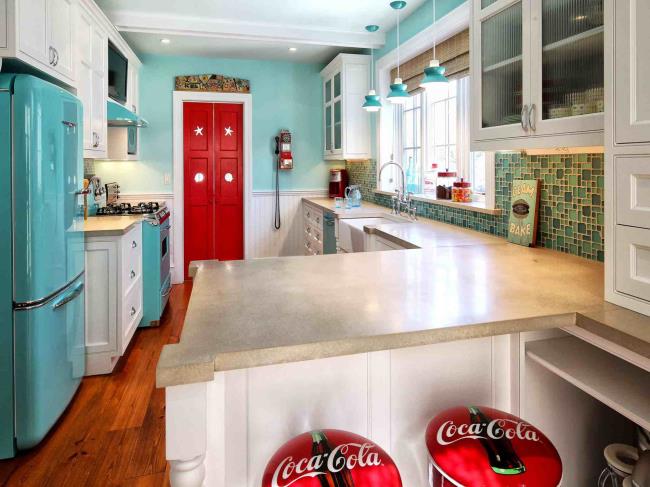 Acid yellow backsplash and walls with gray kitchen cabinets.