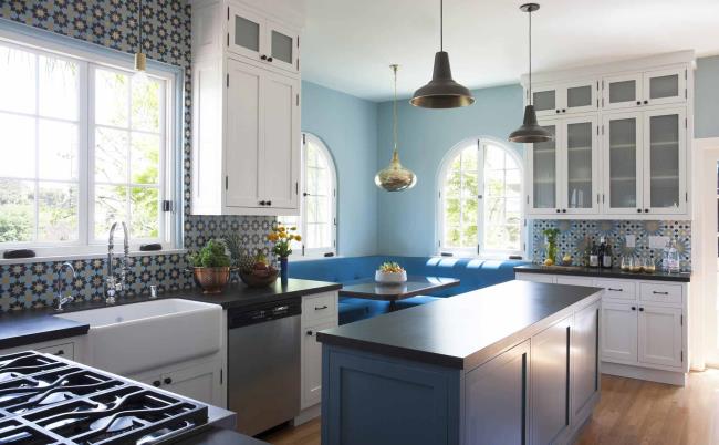 Mix-and-match kitchen tile in a white kitchen.