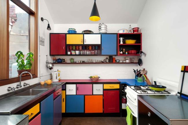 Colorful Mondrian-inspired kitchen with cabinets in different colors.