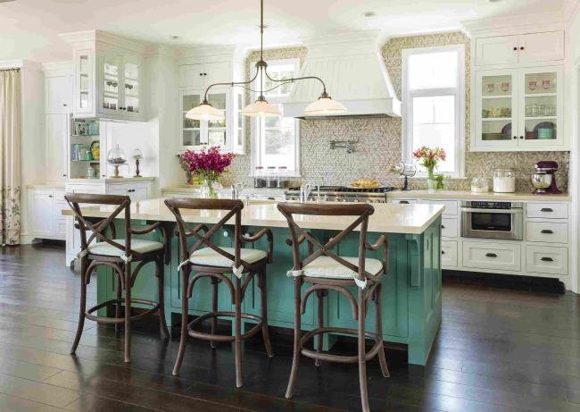 Shabby chic French country kitchen with teal island and three chairs.