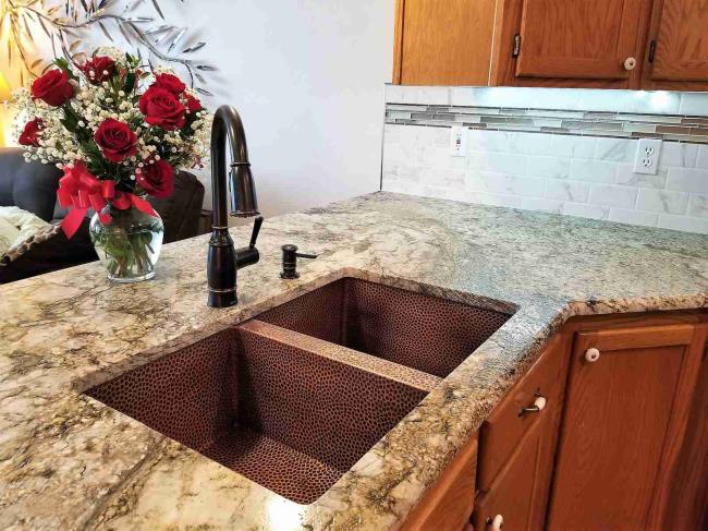 Butcher block and granite farmhouse kitchen