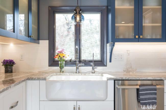 Gray granite countertop in blue and white kitchen