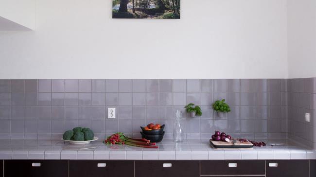 white square tile kitchen counter sink and backsplash