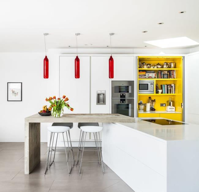 yellow built-in shelving in white modern kitchen