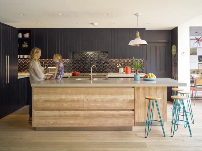 black kitchen with mermaid backsplash