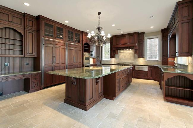 green granite kitchen countertops with dark brown cabinets