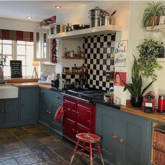 Vintage red stove in a blue kitchen