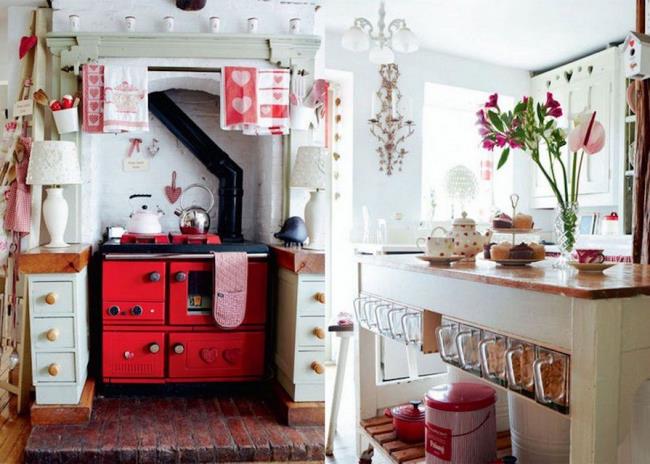 white kitchen with a bright red stove