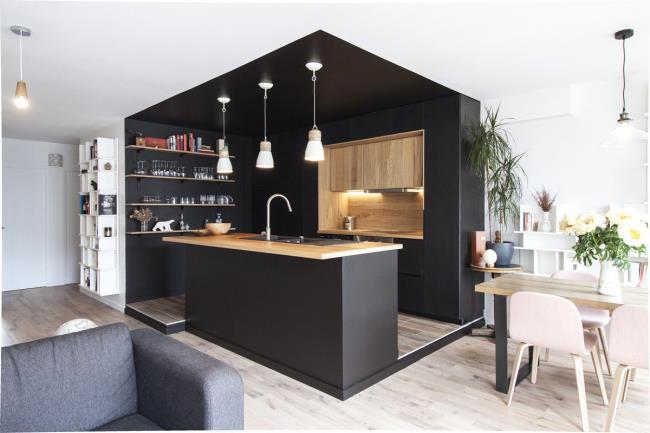 black enclosed kitchen with wood counter