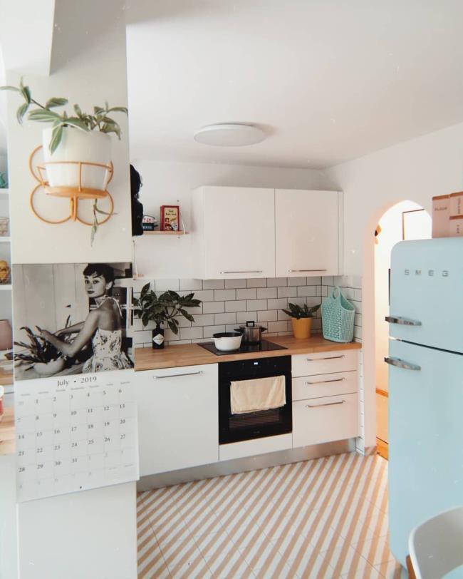 White kitchen with a retro blue fridge