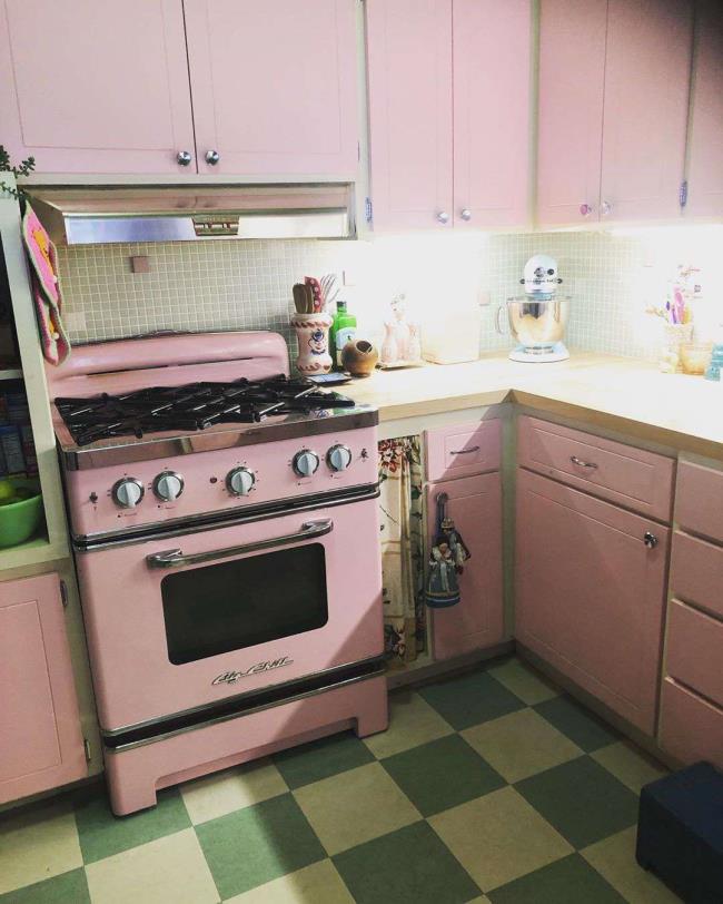 Pink kitchen with checkerboard flooring