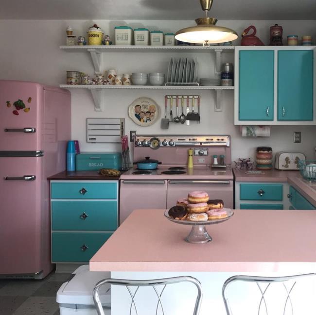 Kitchen with pink and blue cabinets